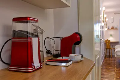 a red appliance sitting on top of a counter at Apartment Econte near old town in Ljubljana