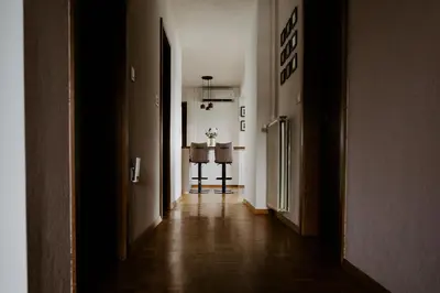 an empty hallway with two tables in a room at Inspired by Nature Homestay