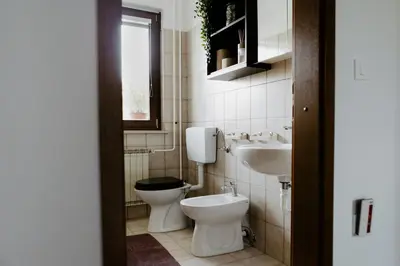 a bathroom with a toilet and a sink at Inspired by Nature Homestay