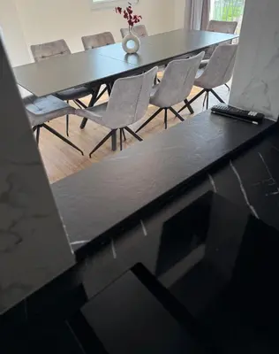 a dining room table and chairs in a room at Resort PJagodic in Cerklje na Gorenjskem