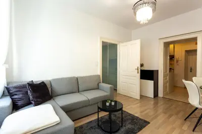a living room with a couch and a table at Old Town Sixteen in Ljubljana