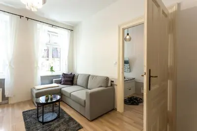 a living room with a couch and a table at Old Town Sixteen in Ljubljana