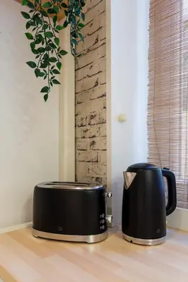two toasters sitting on top of a counter at Old Town Sixteen in Ljubljana