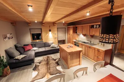 a living room with a couch and a table at Apartments Krvavec in Cerklje na Gorenjskem