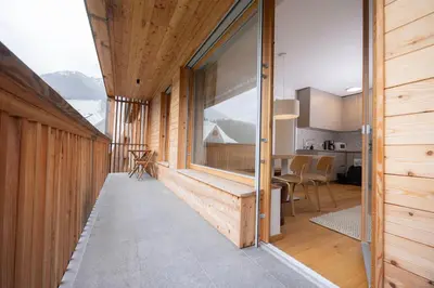 a room with a large window in a house at Apartments Alpine Nest in Kranjska Gora