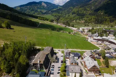 an aerial view of a small town in the mountains at Apartments Alpine Nest in Kranjska Gora