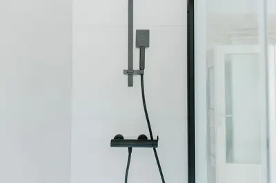 a microphone on a stand next to a wall at Apartment MIDVA in Bled