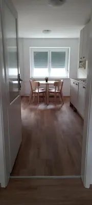 a kitchen and dining room with a table and chairs at SummerHouse in Jesenice