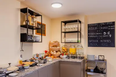 a kitchen with a counter with food on it at Penzion Hosnar in Bovec