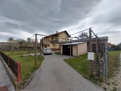 a car is parked in front of a house at at Silva's place in Ptuj