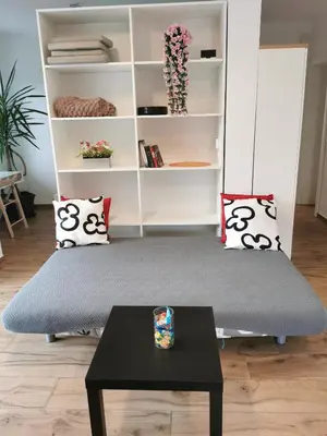 a living room with a couch and a table at Apartma Lipa in Veliki Gaber