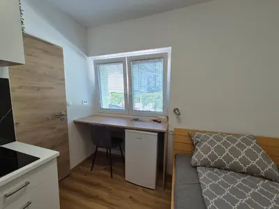 a small room with a desk and a window at Villa Vojkova in Ljubljana