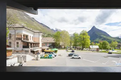 a view of a parking lot with mountains in the background at Alpine Nest Bovec in Bovec
