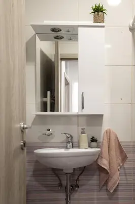 a bathroom with a sink and a mirror at Lili Rooms in Stahovica