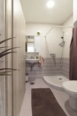 a bathroom with a sink and a toilet and a tub at Lili Rooms in Stahovica