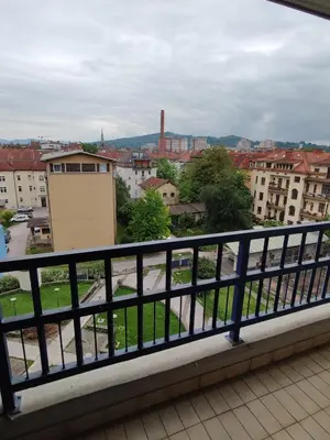 a view of a city from a balcony at MCS Metro Residence in Ljubljana