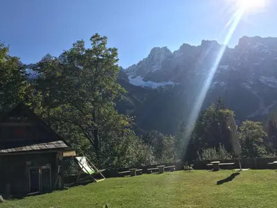 a view of a mountain with a beam of light at Planinski dom - Mihov dom na Vršiču in Kranjska Gora