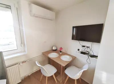 a small room with a table and two chairs at Apartment Twin 2 in Ljubljana