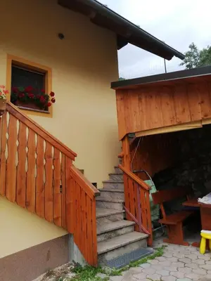 a set of stairs leading to a house with a balcony at Apartmaji Daša & Anže in Bohinj