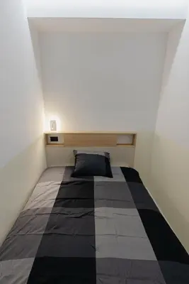 a bedroom with a bed in a room at ALPEART GOZD MARTULJEK HOLIDAY unit in Kranjska Gora