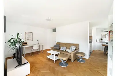 a living room with a couch and a table at Peaceful City Stay in Ljubljana