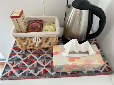 a basket with books and other items on a table at Apartma Vrbnjak in Bohinj
