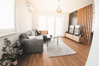 a living room with a couch and a table at Stork's Nest - Moravske Toplice in Moravske Toplice