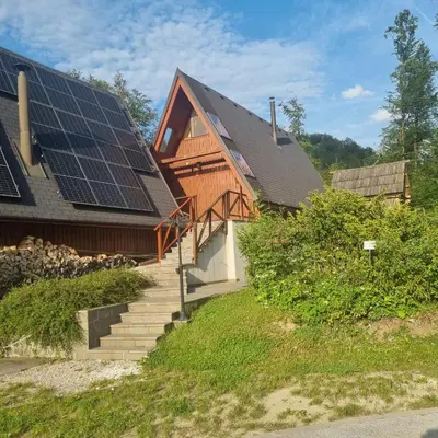 a house with solar panels on the roof at Apartment Bohinj with excellent location in Bohinj