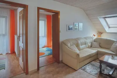 a living room with a couch and a window at Apartment Erika in Idrija