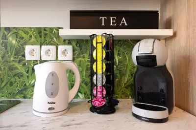 a coffee maker and a blender on a counter at Apartma Seničica in Ljubljana