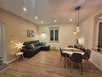 a living room with a couch and a table at Gala Lenassi in Kamnik