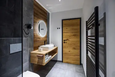 a bathroom with a sink and a mirror at Family and Friends Apartments Bled in Spodnje Gorje