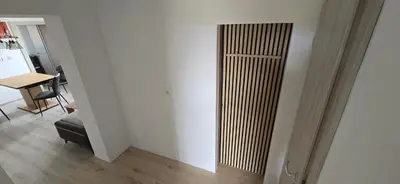 a room with a door with a chair and a table at Apartma Martin in Miklavž pri Ormožu