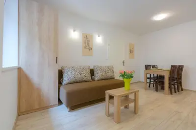 a living room with a couch and a table at Old Town ground floor in Ljubljana