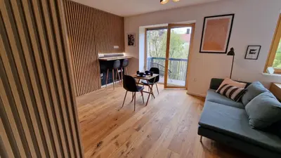 a living room with a couch and a table at Biohacker Ljubljana in Ljubljana