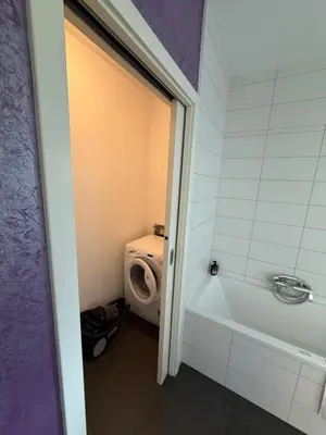 a bathroom with a toilet and a bath tub at My Family Home Bled in Bled