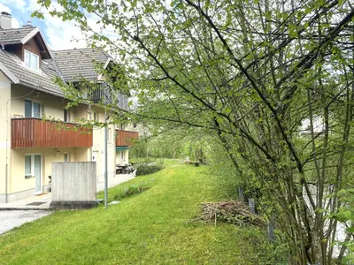 an empty yard next to a house at Bee Apartment in Bohinj