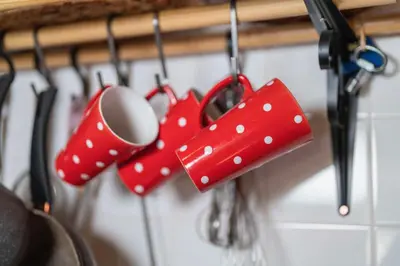 a group of kitchen utensils hanging on a rack at Chalet Vogar in Bohinj