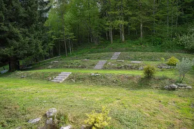 a garden with steps in the middle of a field at Grajski kamp - pitch your own tent in Kočevje