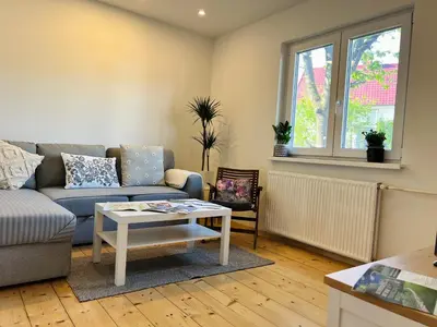 a living room with a couch and a table at St Mountain Escape in Žirovnica