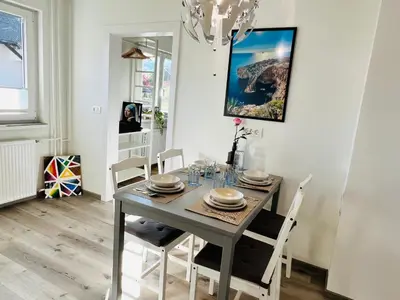 a dining room with a table and chairs at St Mountain Escape in Žirovnica