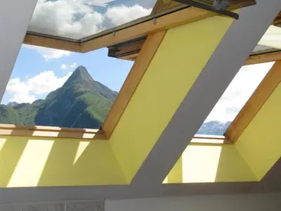 a window in a room with a view of a mountain at Apartment Gaspercic in Bovec