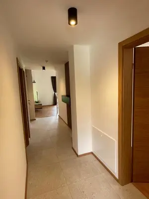an empty hallway with a door and a room at Apartment Tanja 3 Bedroom, Mountain View & Family Stay in Golnik