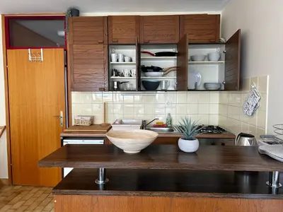 a kitchen with a counter with a bowl on it at Apartma Giorgo in Bovec