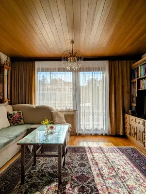 a living room with a couch and a table at Apartma Rustika in Bled