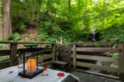 a candle sitting on top of a table on a deck at Old mill in Štore