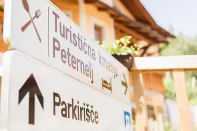 a street sign in front of a house at Farm Stay Peternelj in Ilirska Bistrica