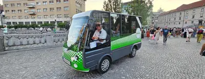 a small green and on a city street at Apartman min & Ljubljana in Ljubljana