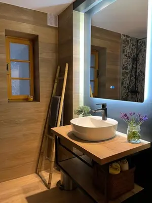 a bathroom with a sink and a mirror at Apartment Abinkar in Tolmin