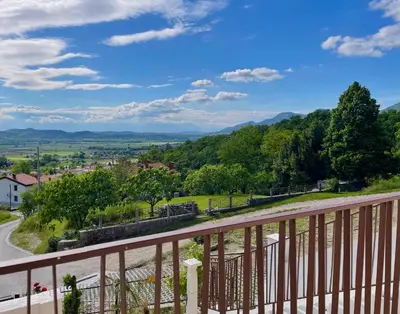 a view from the balcony of a house at Vipava View Studio Apartments in Šempas
